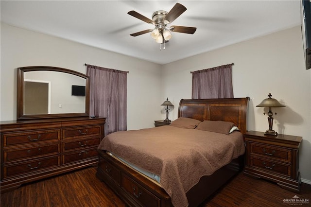 bedroom featuring ceiling fan and dark wood-style flooring
