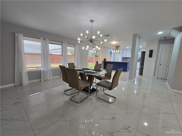 dining space featuring a notable chandelier