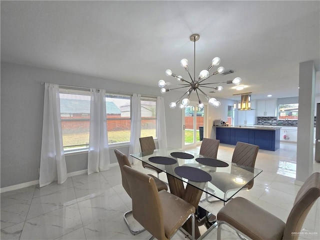 dining space with a notable chandelier