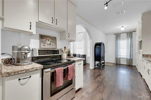 2600 Northgate Ln, Mcallen, TX 78504 - kitchen with electric range, arched walkways, visible vents, and tasteful backsplash