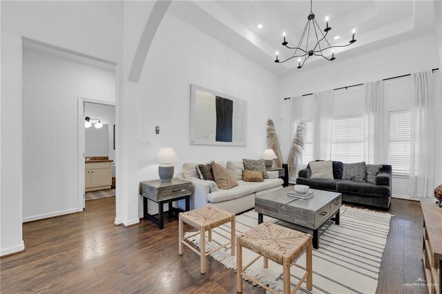 2600 Northgate Ln, Mcallen, TX 78504 - living room with wood-type flooring, a chandelier, and a raised ceiling
