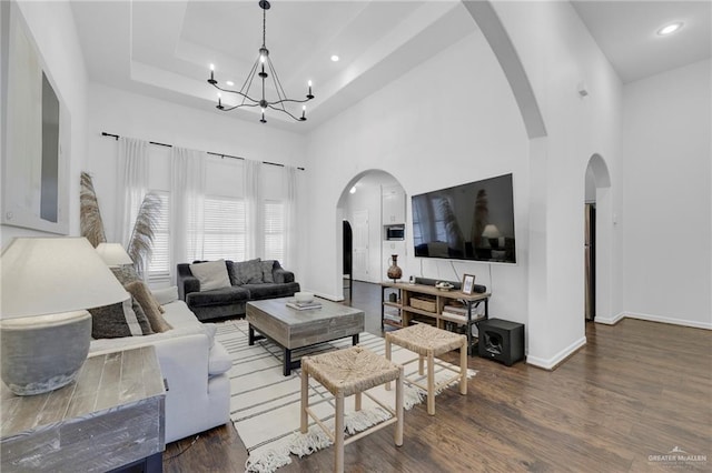 2600 Northgate Ln, Mcallen, TX 78504 - living room featuring a high ceiling, a chandelier, and wood finished floors