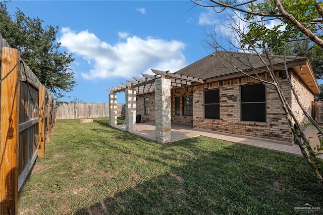 2600 Northgate Ln, Mcallen, TX 78504 - rear view of house with brick siding, a fenced backyard, a yard, a patio, and a pergola