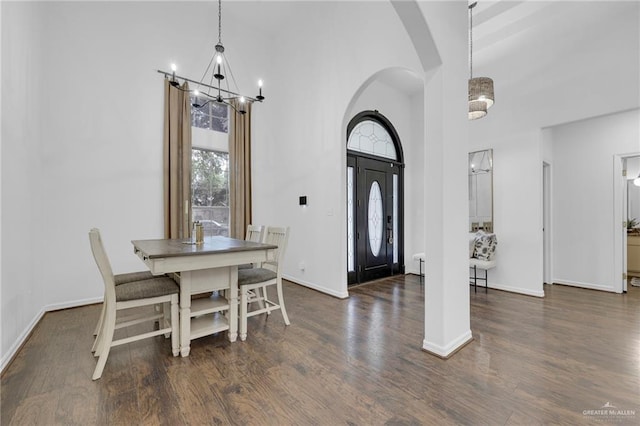 2600 Northgate Ln, Mcallen, TX 78504 - entryway with an inviting chandelier, arched walkways, wood finished floors, and a towering ceiling