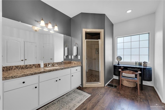 2600 Northgate Ln, Mcallen, TX 78504 - full bathroom with vanity, recessed lighting, baseboards, wood finished floors, and a stall shower