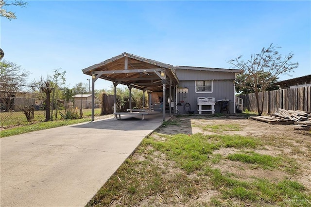 exterior space with a carport