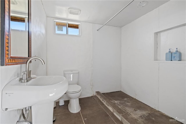 bathroom featuring sink and toilet