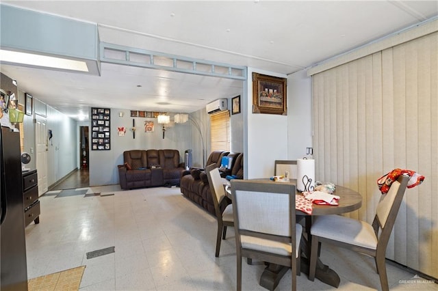 dining space featuring a wall mounted air conditioner