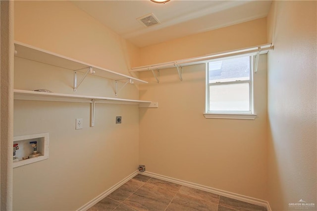 washroom featuring washer hookup and electric dryer hookup