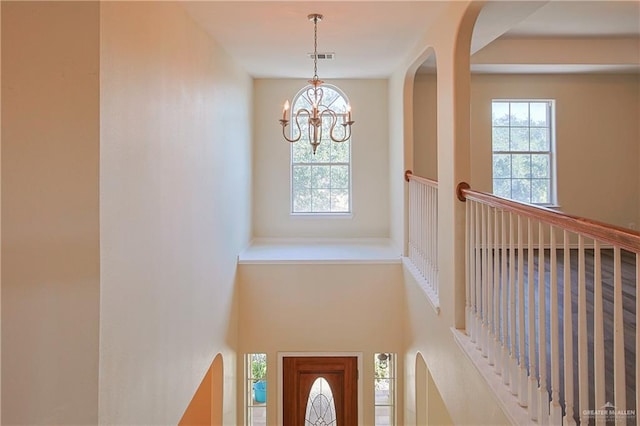 entryway featuring an inviting chandelier