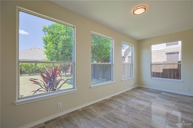 unfurnished room with plenty of natural light