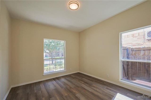 spare room featuring dark hardwood / wood-style floors