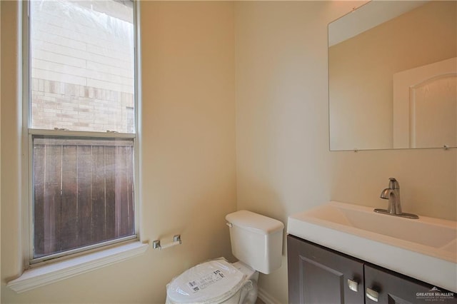 bathroom featuring vanity and toilet