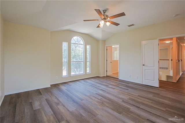 unfurnished room featuring hardwood / wood-style floors, ceiling fan, and vaulted ceiling