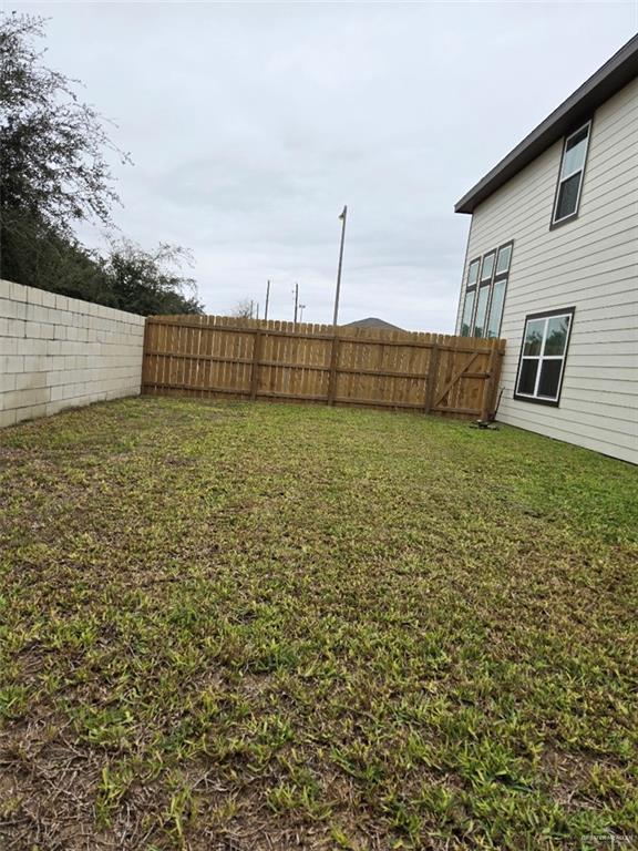 view of yard with a fenced backyard