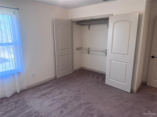 unfurnished bedroom featuring carpet