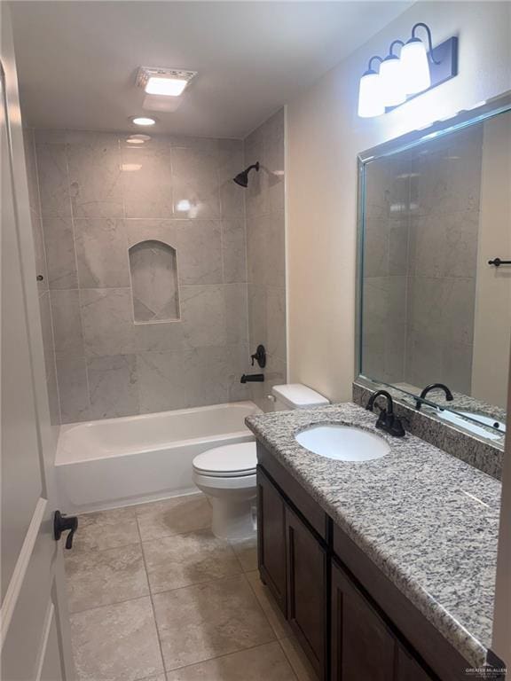 full bath with  shower combination, vanity, toilet, and tile patterned floors