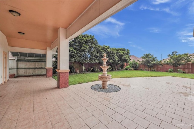 1410 Lobelia St, Weslaco, TX 78599 - fenced backyard with a patio area