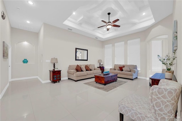 1410 Lobelia St, Weslaco, TX 78599 - living room featuring ceiling fan, coffered ceiling, recessed lighting, arched walkways, and light tile patterned floors