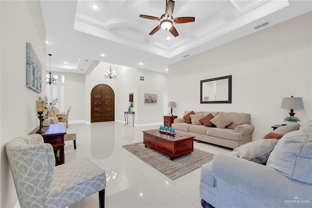 1410 Lobelia St, Weslaco, TX 78599 - living area with recessed lighting, a chandelier, a ceiling fan, tile patterned flooring, and a raised ceiling
