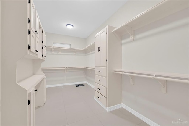 1410 Lobelia St, Weslaco, TX 78599 - walk in closet with light tile patterned flooring