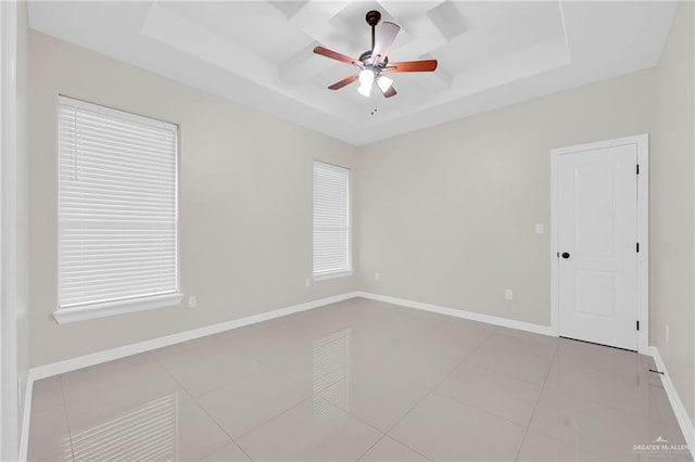 1410 Lobelia St, Weslaco, TX 78599 - empty room with a raised ceiling, ceiling fan, and light tile patterned floors