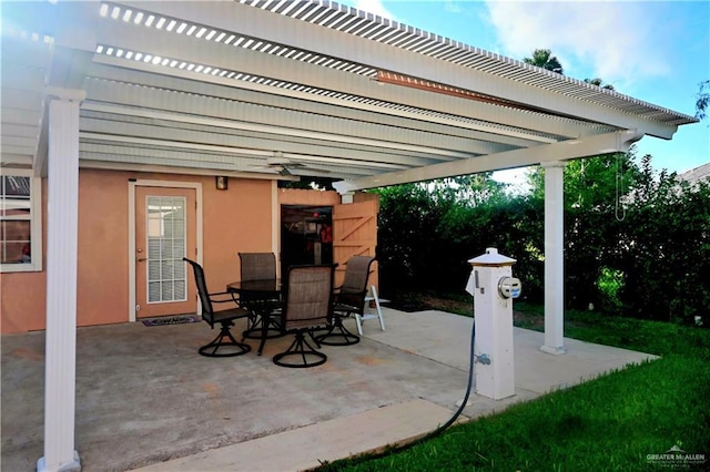 view of patio featuring a pergola and outdoor dining space