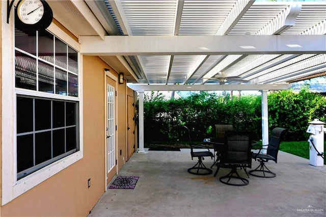 view of patio featuring a pergola and outdoor dining area