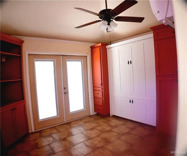 unfurnished bedroom with stone finish flooring, crown molding, ceiling fan, and french doors