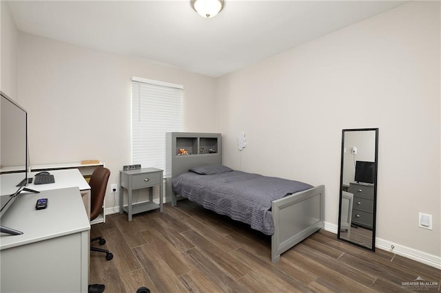 7719 N 39th Ln, Mcallen, TX 78504 - bedroom featuring dark wood-style flooring, baseboards, and a desk