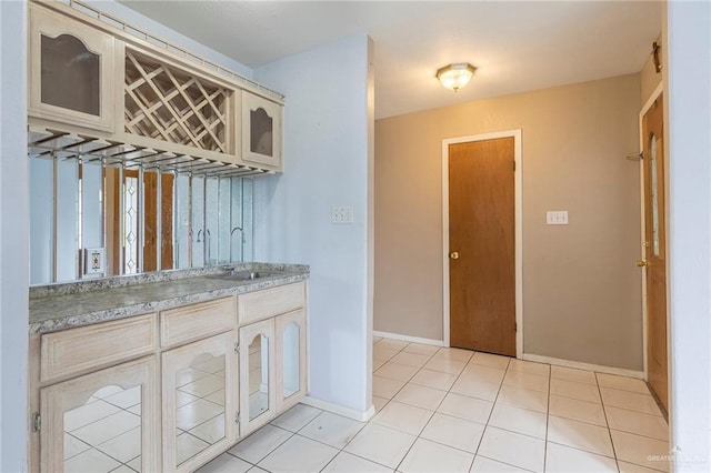 2915 Roselawn Dr, Weslaco, TX 78596 - kitchen with light countertops, glass insert cabinets, and light tile patterned flooring