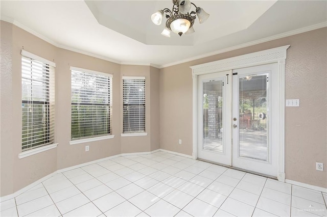 2915 Roselawn Dr, Weslaco, TX 78596 - empty room with a chandelier, a tray ceiling, and crown molding