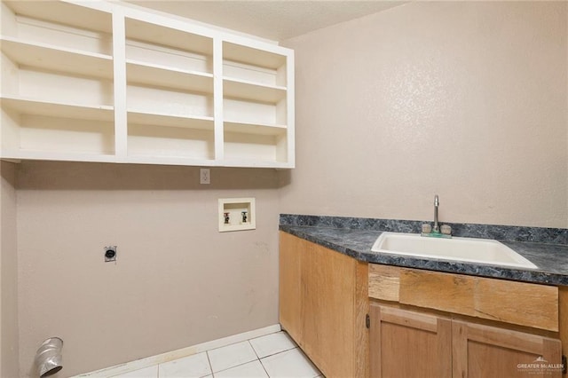 2915 Roselawn Dr, Weslaco, TX 78596 - washroom with washer hookup, hookup for an electric dryer, and light tile patterned floors
