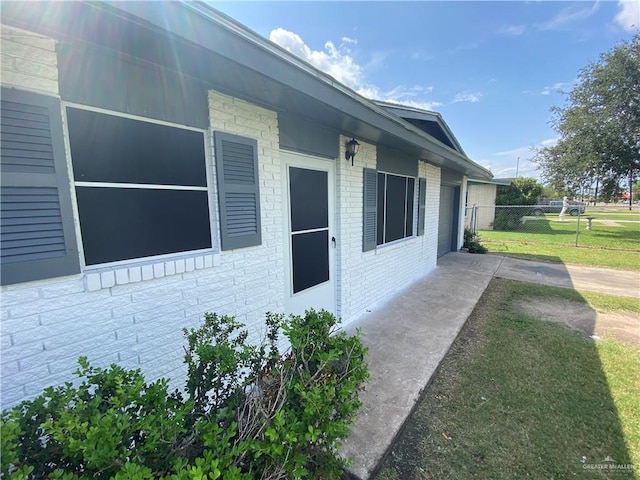 view of home's exterior with a lawn