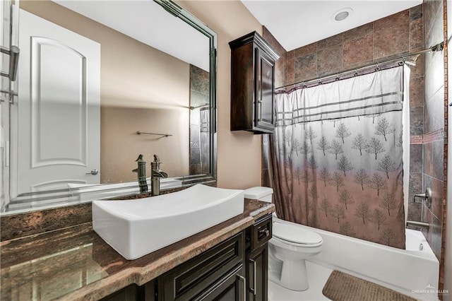 full bathroom with tile patterned flooring, shower / tub combo with curtain, vanity, and toilet