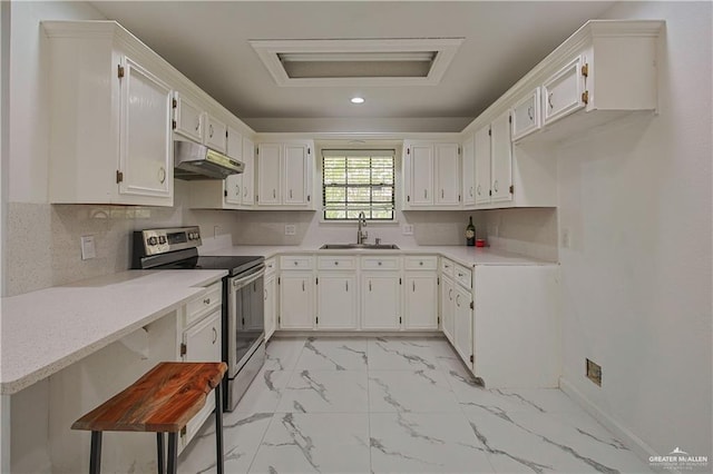 kitchen featuring sink, white cabinets, stainless steel electric range oven, and tasteful backsplash