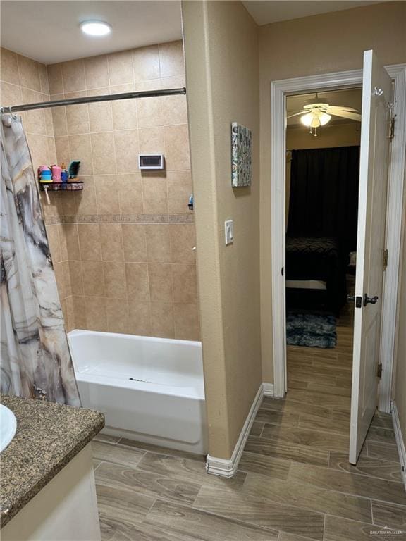 bathroom with shower / bath combo and vanity