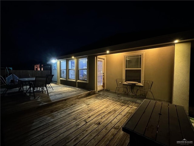 view of deck at twilight