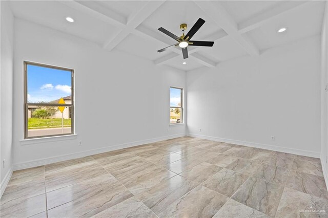 spare room with ceiling fan, beam ceiling, and coffered ceiling