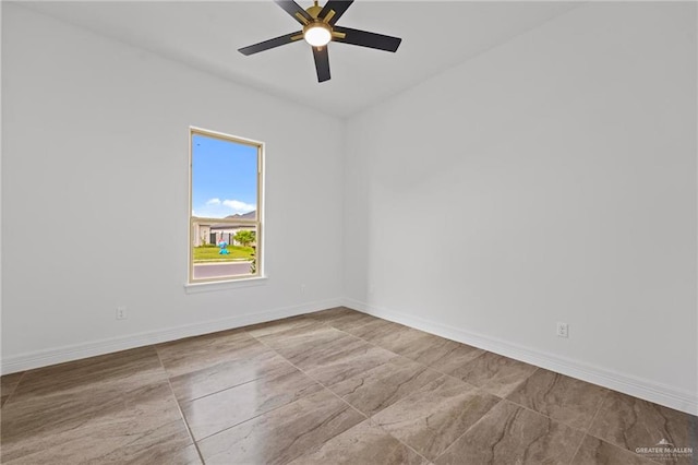 spare room with ceiling fan