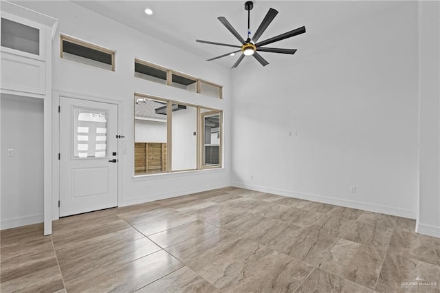 foyer entrance with ceiling fan