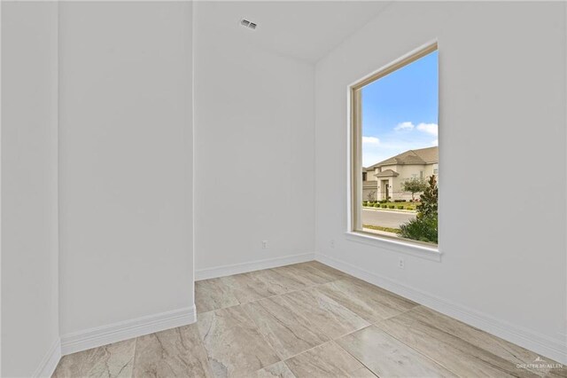 spare room featuring a wealth of natural light