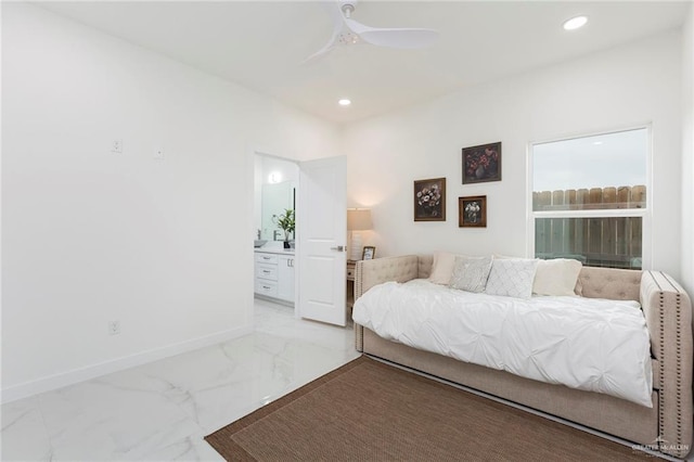 bedroom featuring ceiling fan and ensuite bath