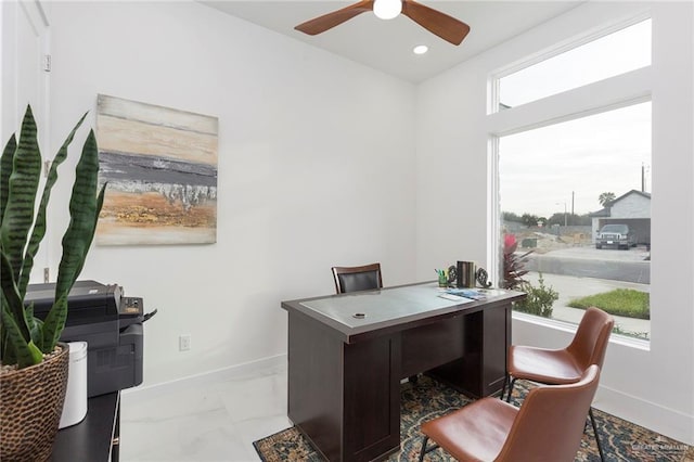 office space with ceiling fan and plenty of natural light