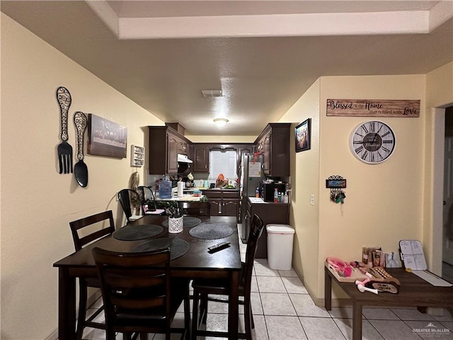 dining room featuring light tile patterned floors