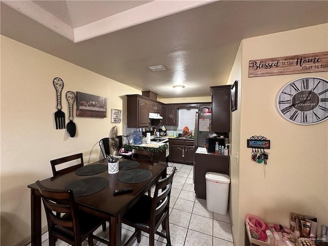 dining area with light tile patterned flooring