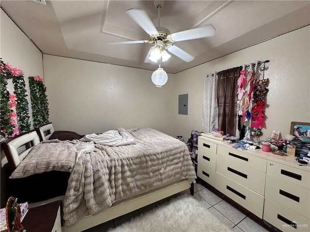 bedroom with light tile patterned floors, electric panel, and ceiling fan