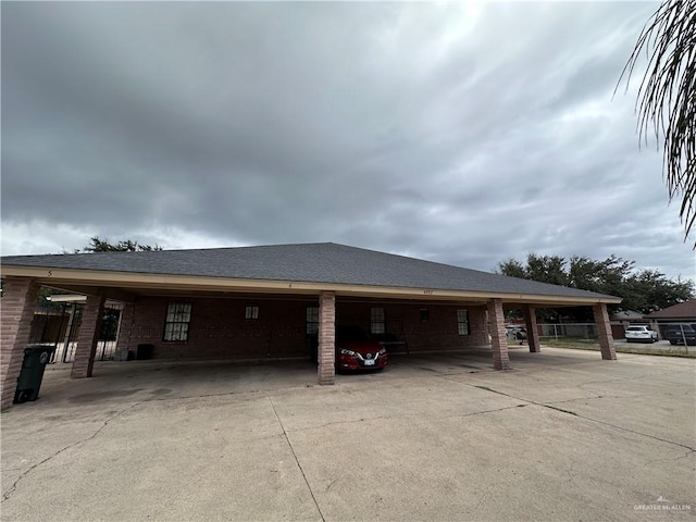 view of side of property featuring a carport