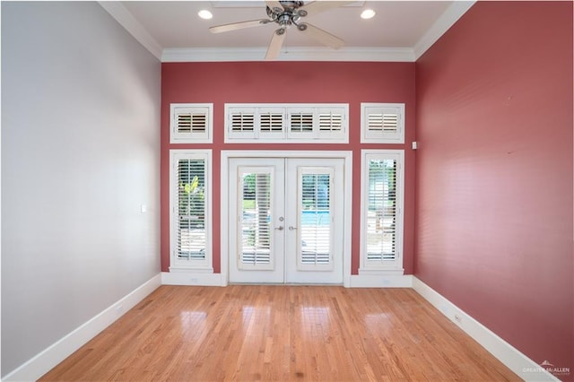 doorway to outside featuring crown molding, french doors, ceiling fan, and light hardwood / wood-style floors