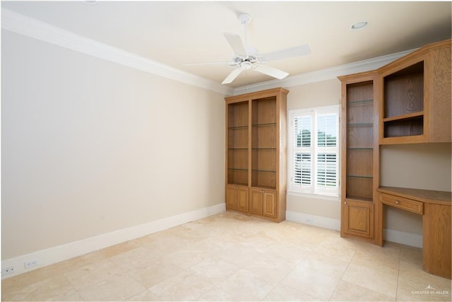 unfurnished office with ceiling fan and crown molding